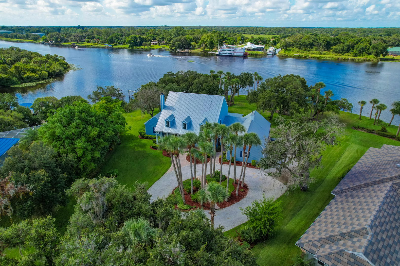 an aerial view of a house with a lake view