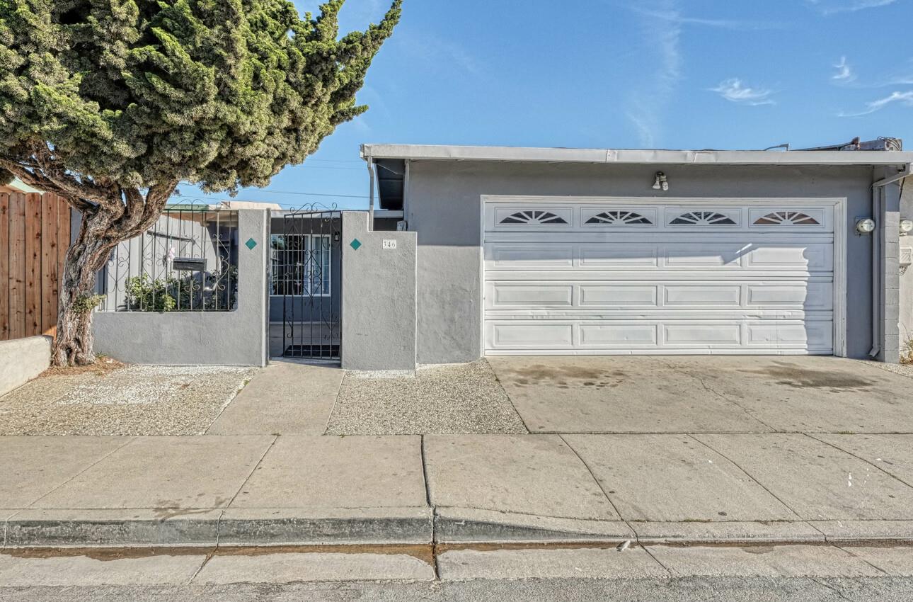 a front view of a house with a garage