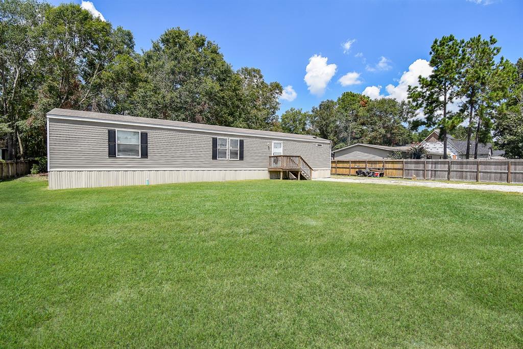 a house view with a sitting space and garden