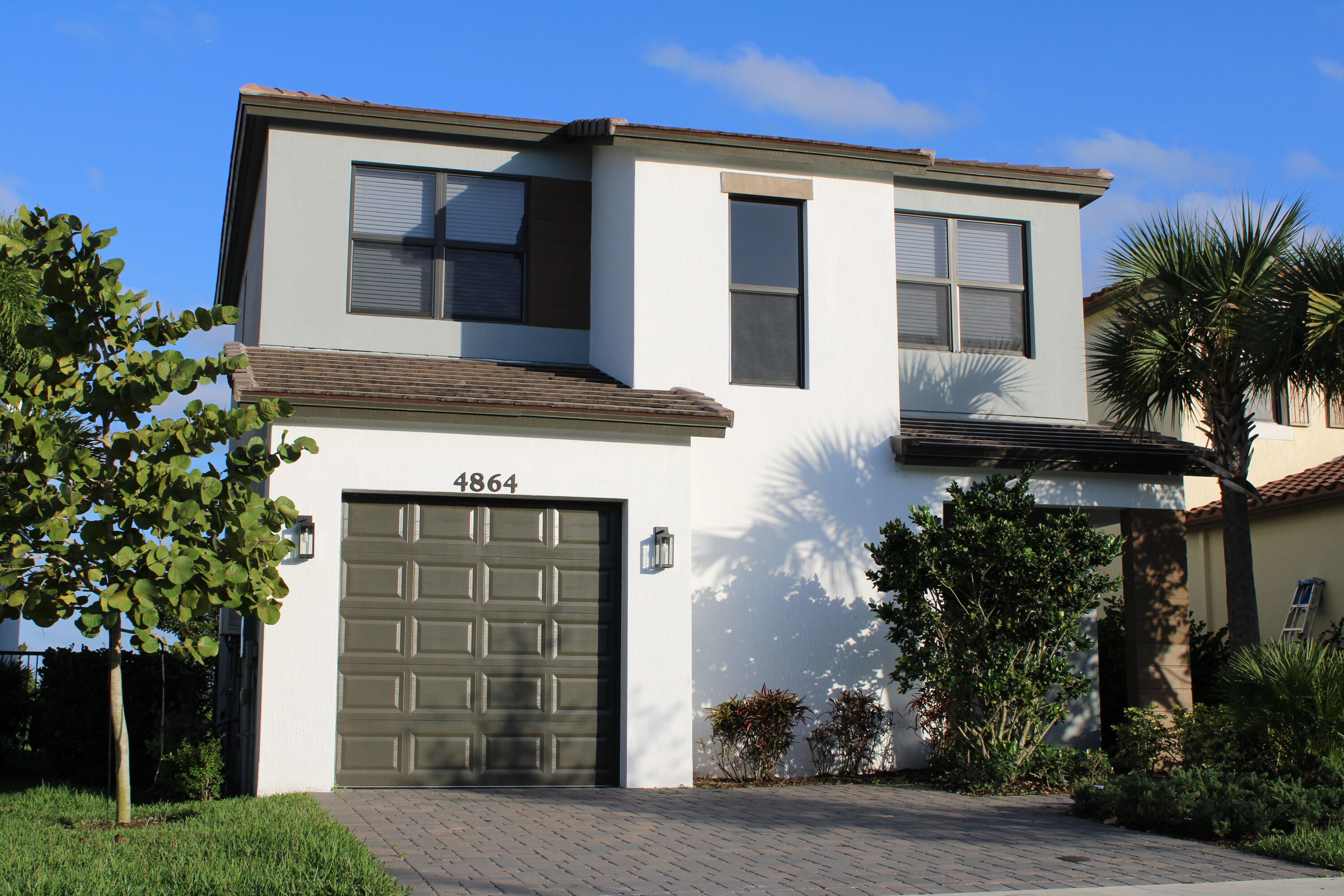 a front view of a house with a garage