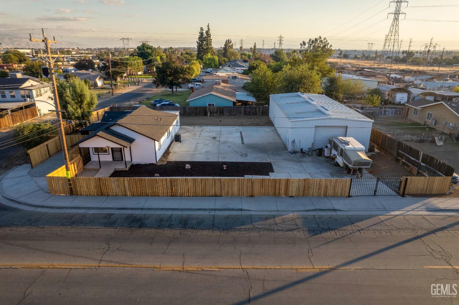 an aerial view of a house with a swimming pool