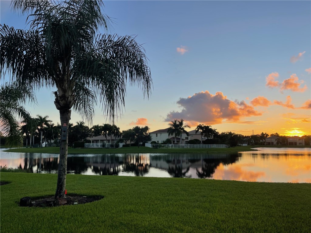 a view of a lake with a big yard