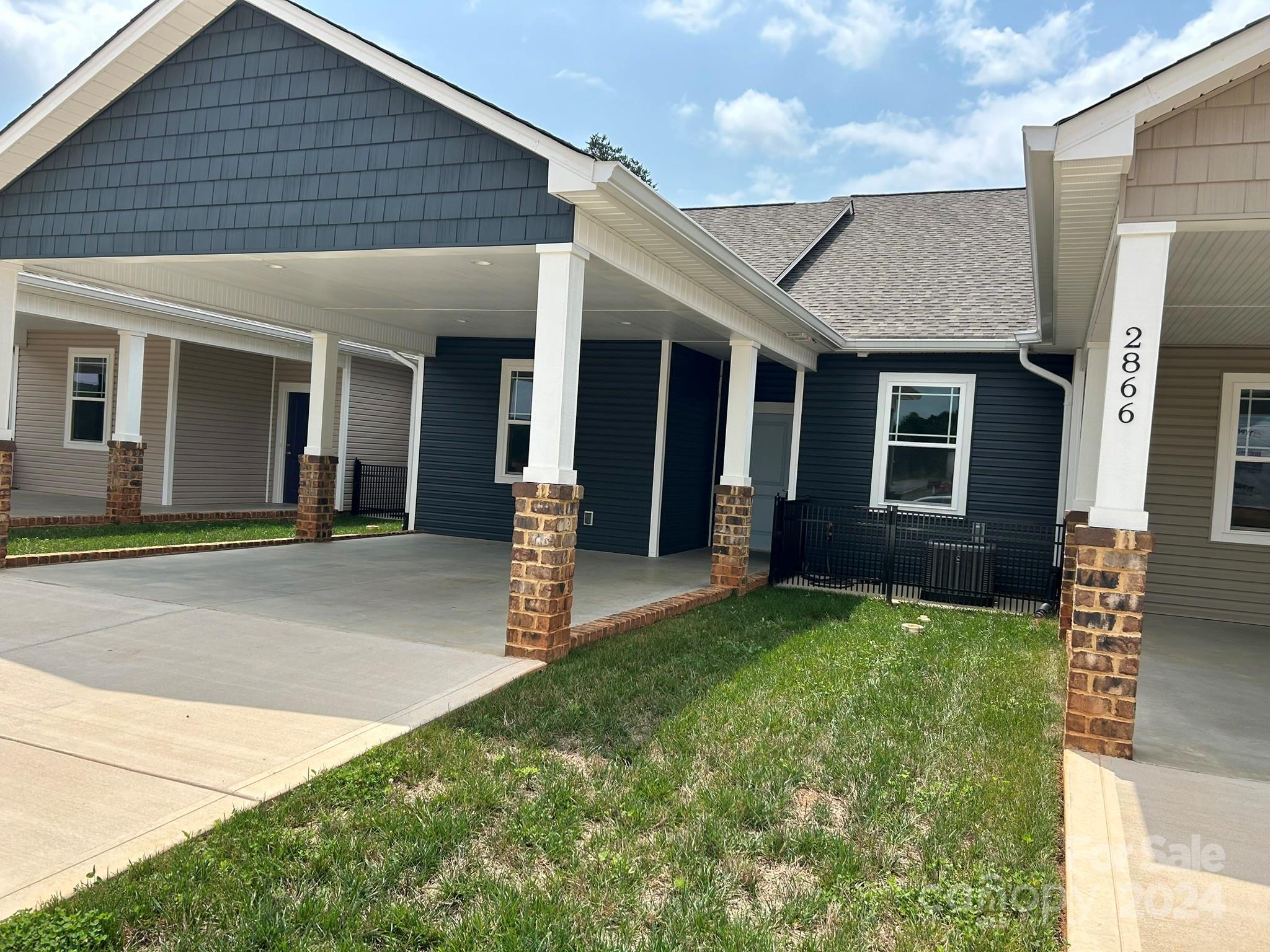 a front view of a house with a yard and porch