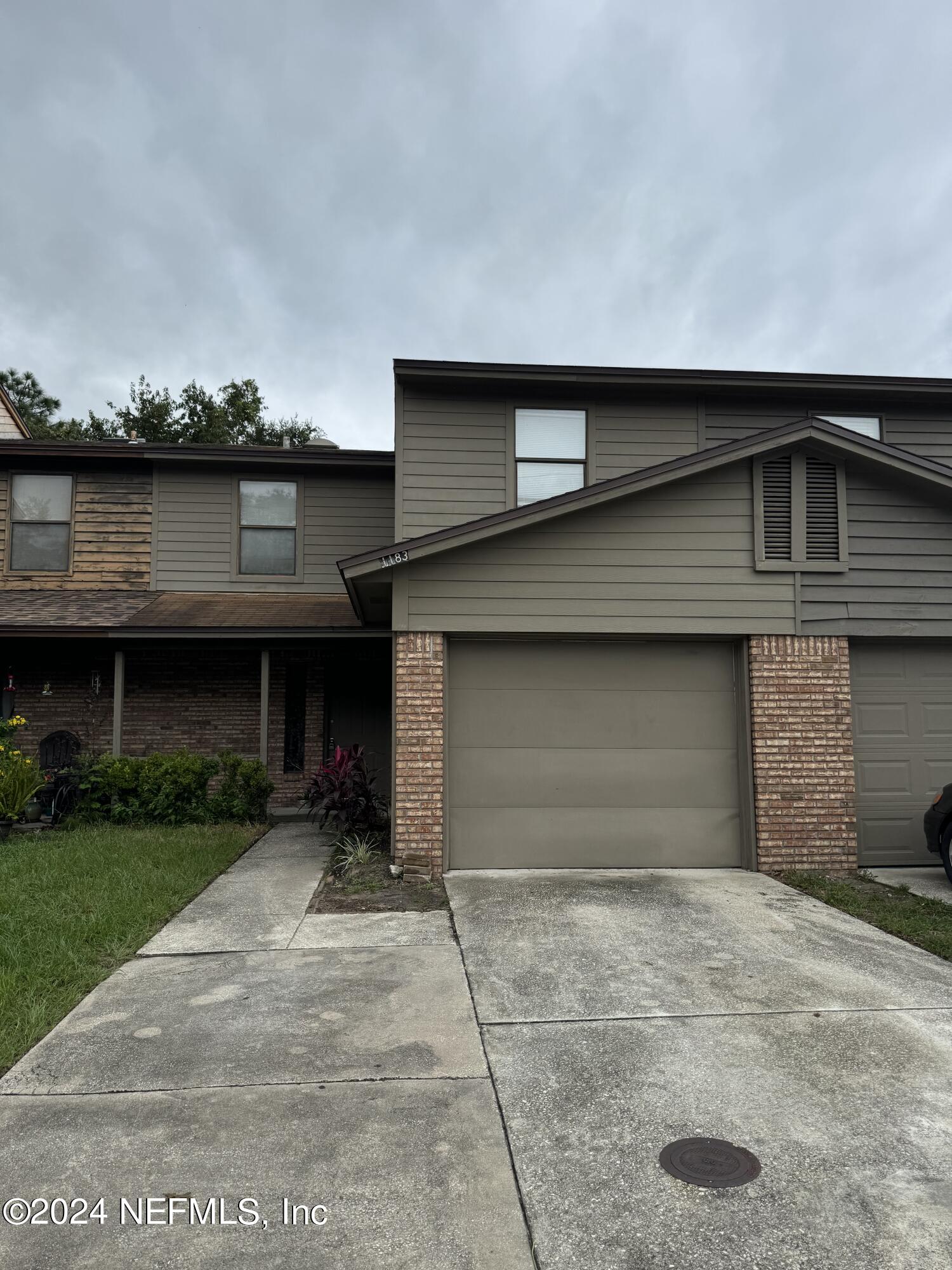 a front view of a house with a garage