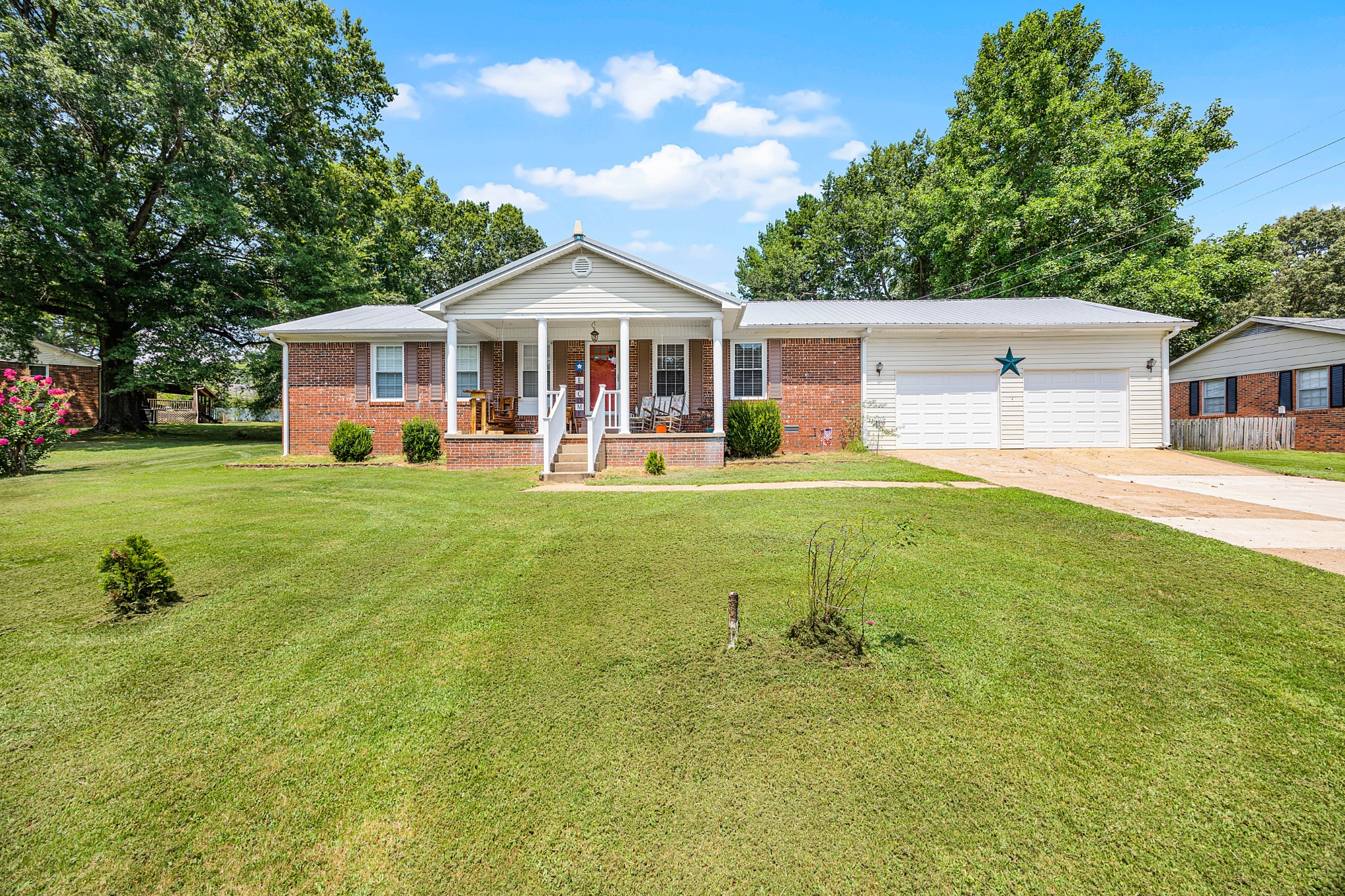 a front view of a house with a yard