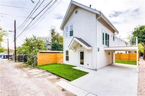 a view of a house with a yard and garage