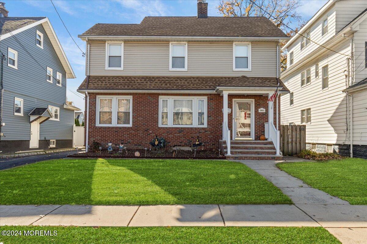 a front view of a house with a yard