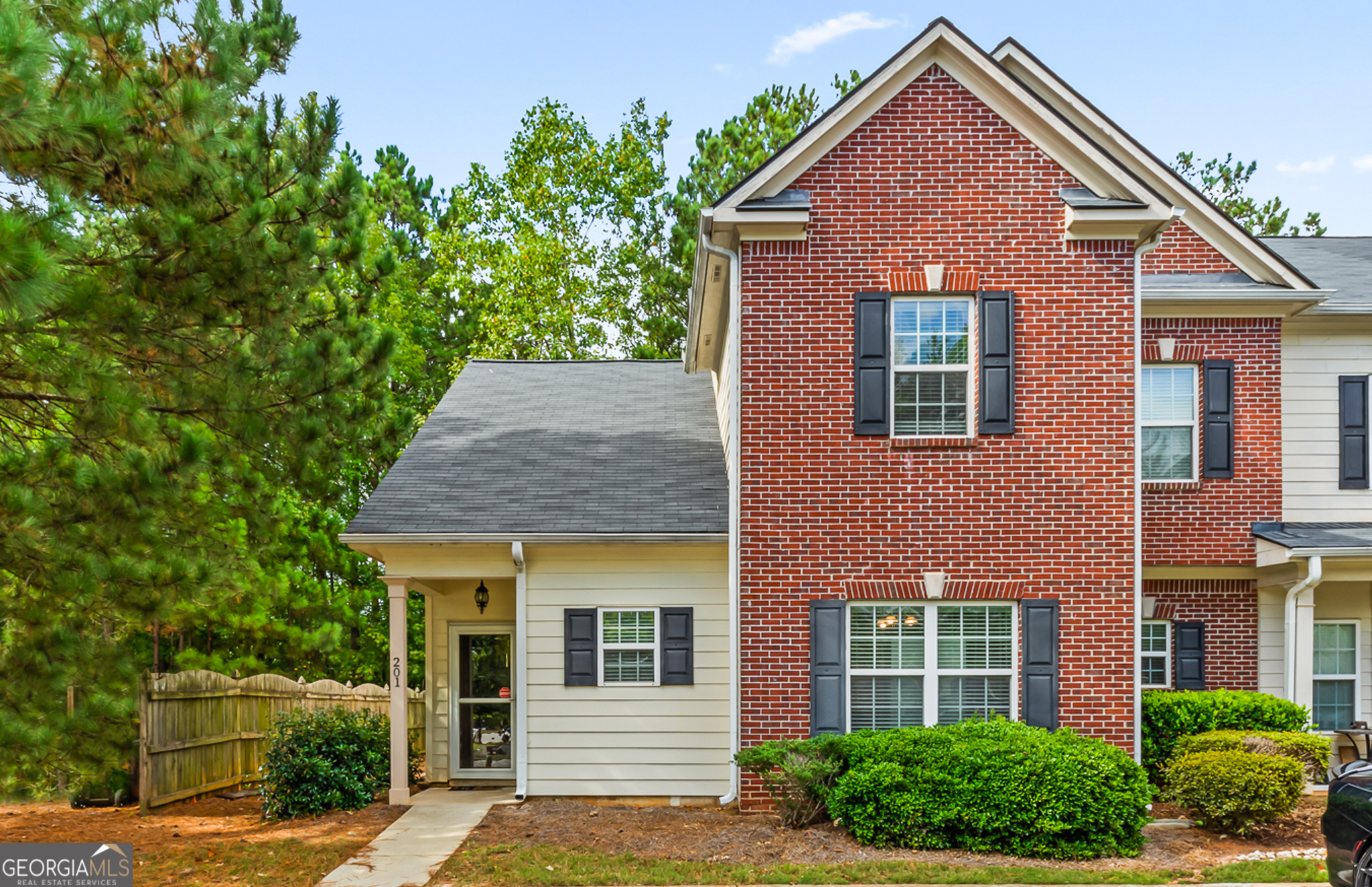 front view of a house with a yard