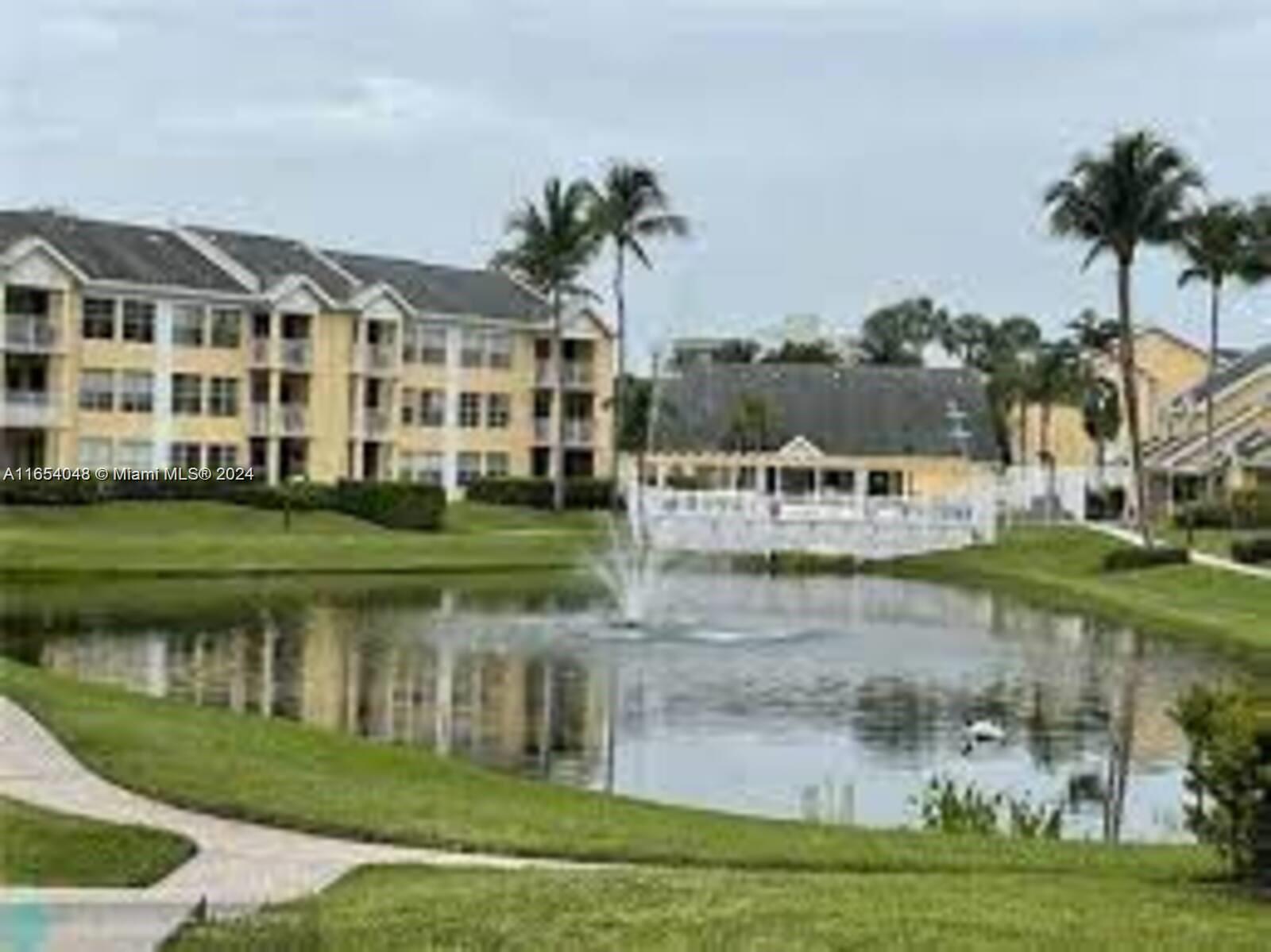 a view of a lake with a building in the background