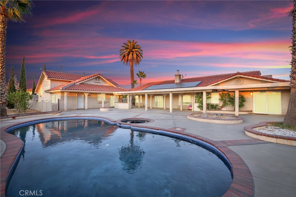 a swimming pool with outdoor seating