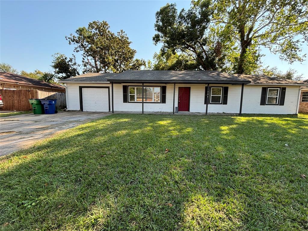 a house that has a tree in front of the house