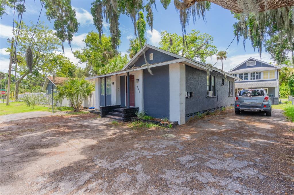 a view of a house with a yard and garage