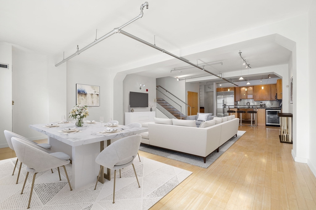 a living room with furniture and a table