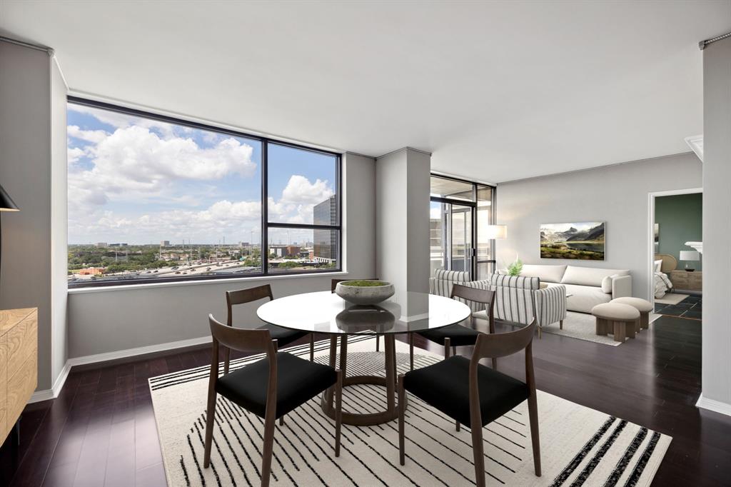 a view of a dining room with furniture window and wooden floor