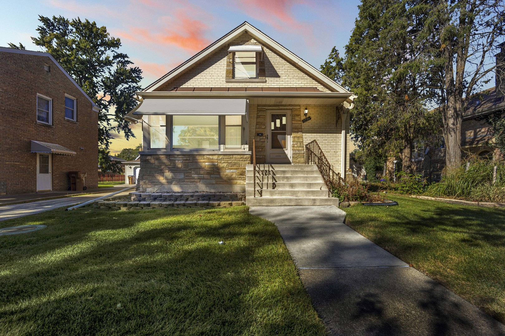 a front view of a house with a yard