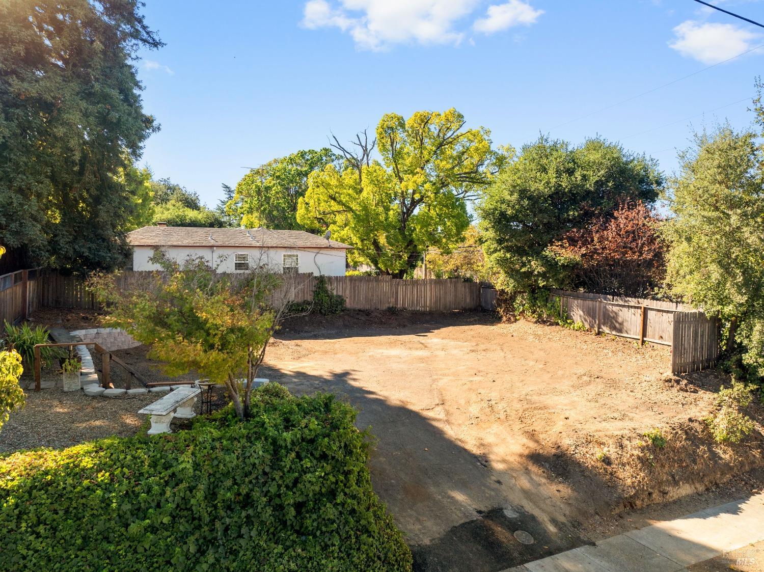 a view of a backyard of the house