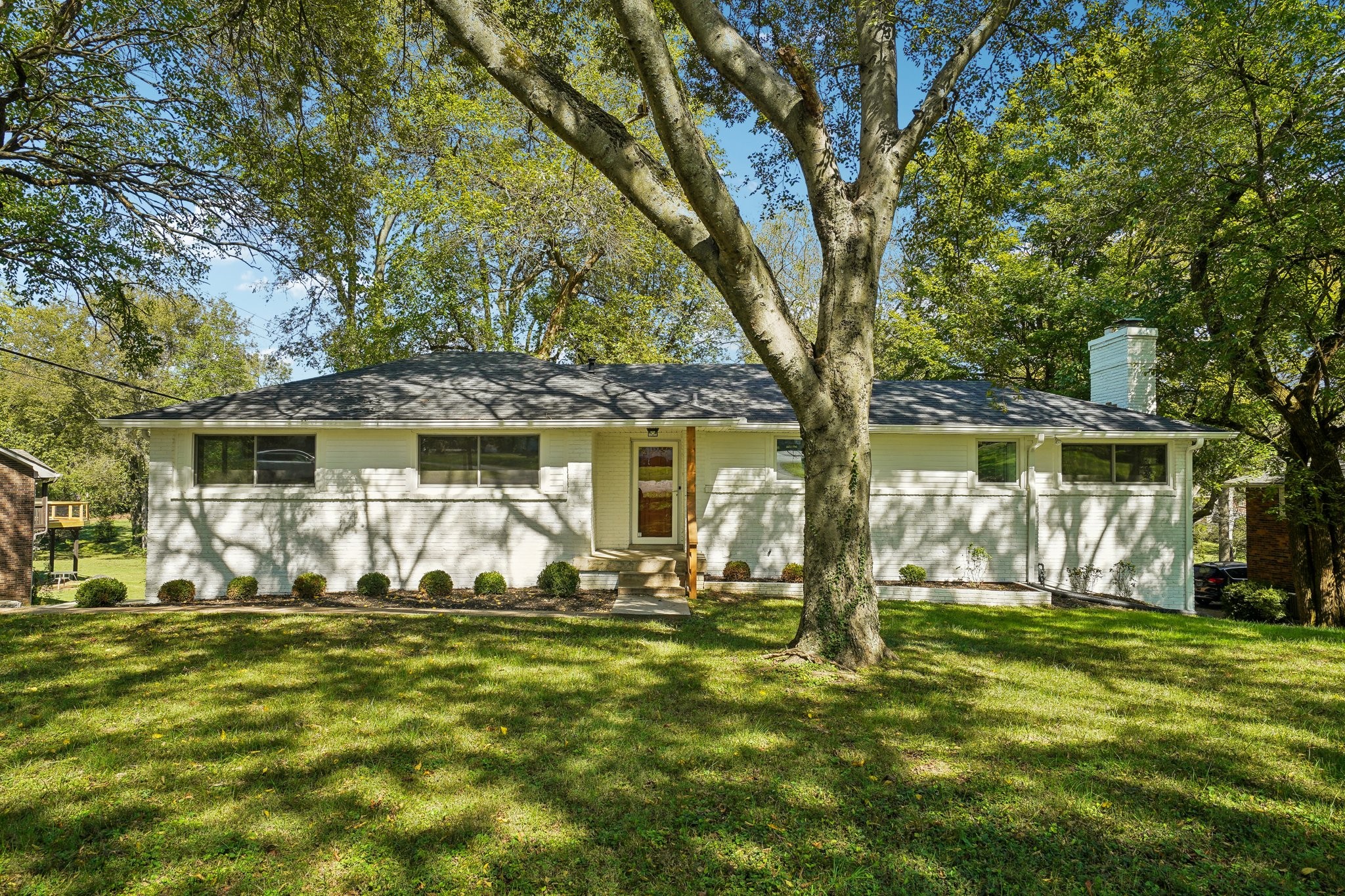 a front view of house with yard outdoor seating and yard