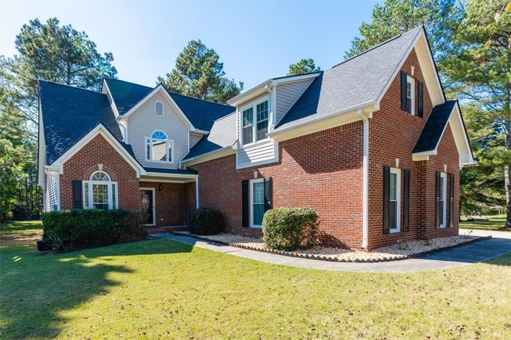 a front view of a house with a yard