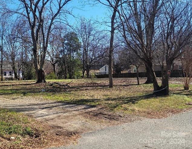 a view of a yard with a tree