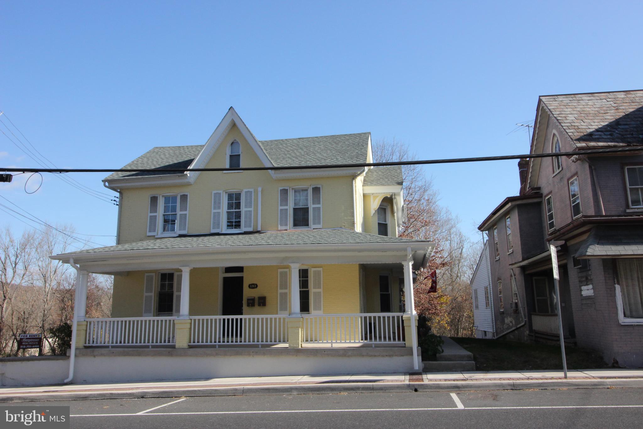 a front view of a house with a garage