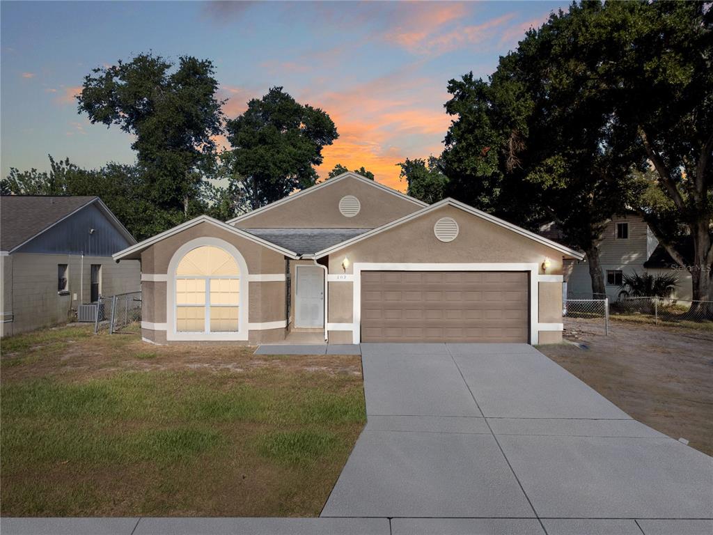 a front view of a house with yard