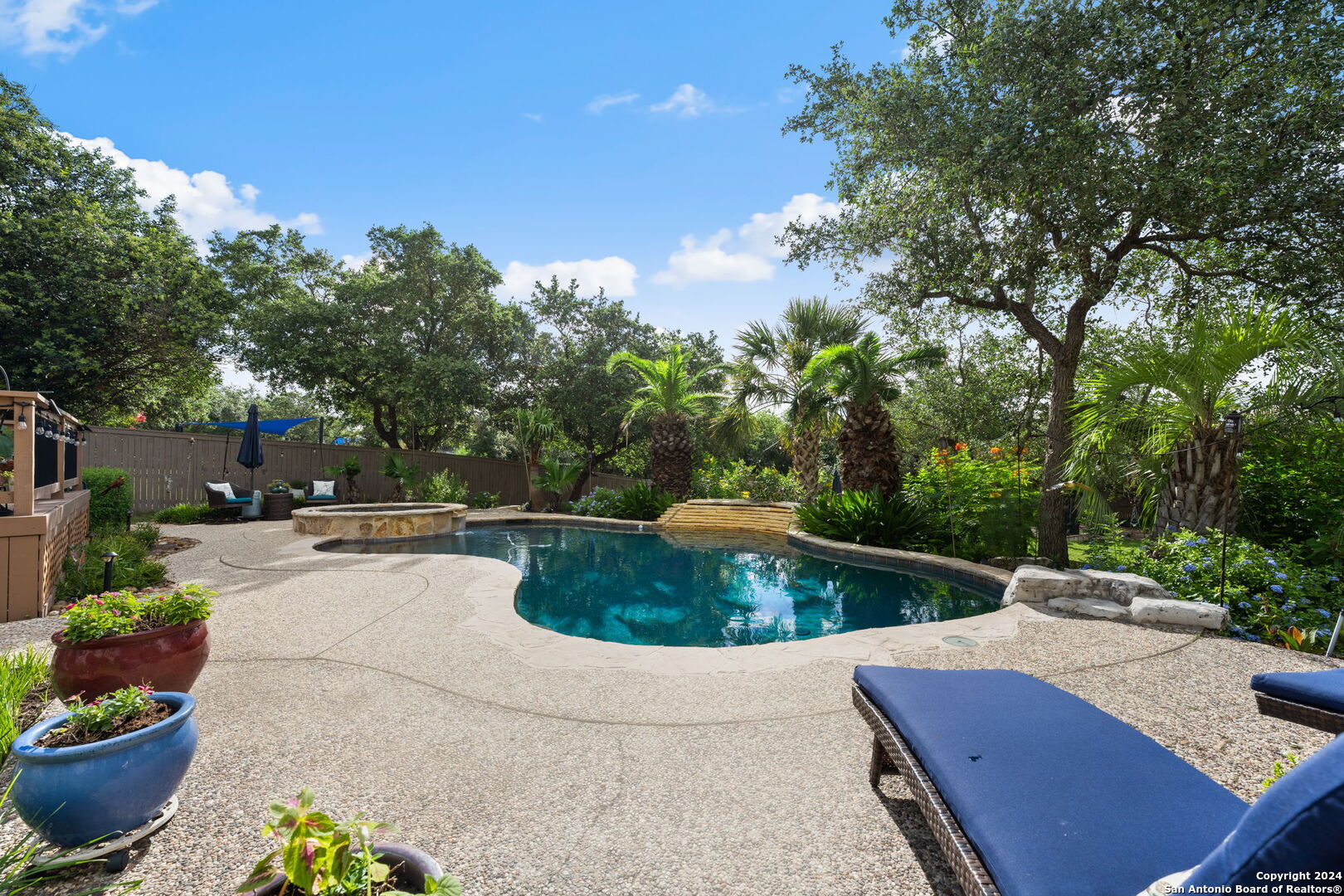 a view of a backyard with sitting area