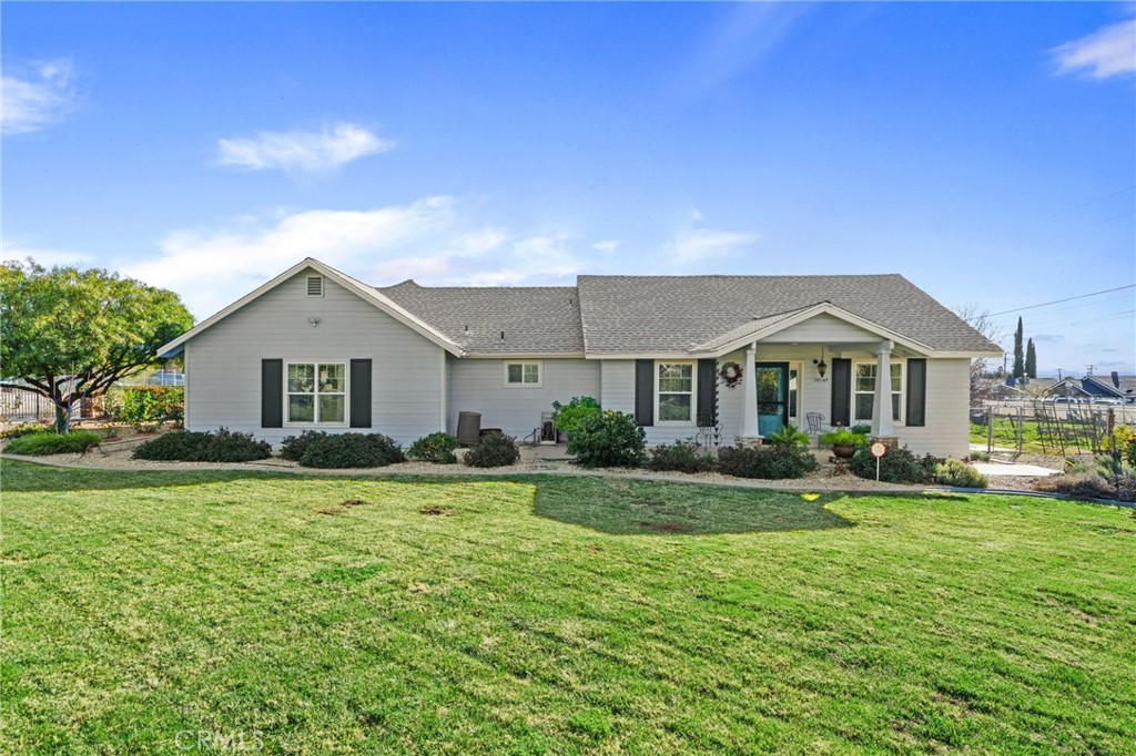 a front view of house with yard and green space