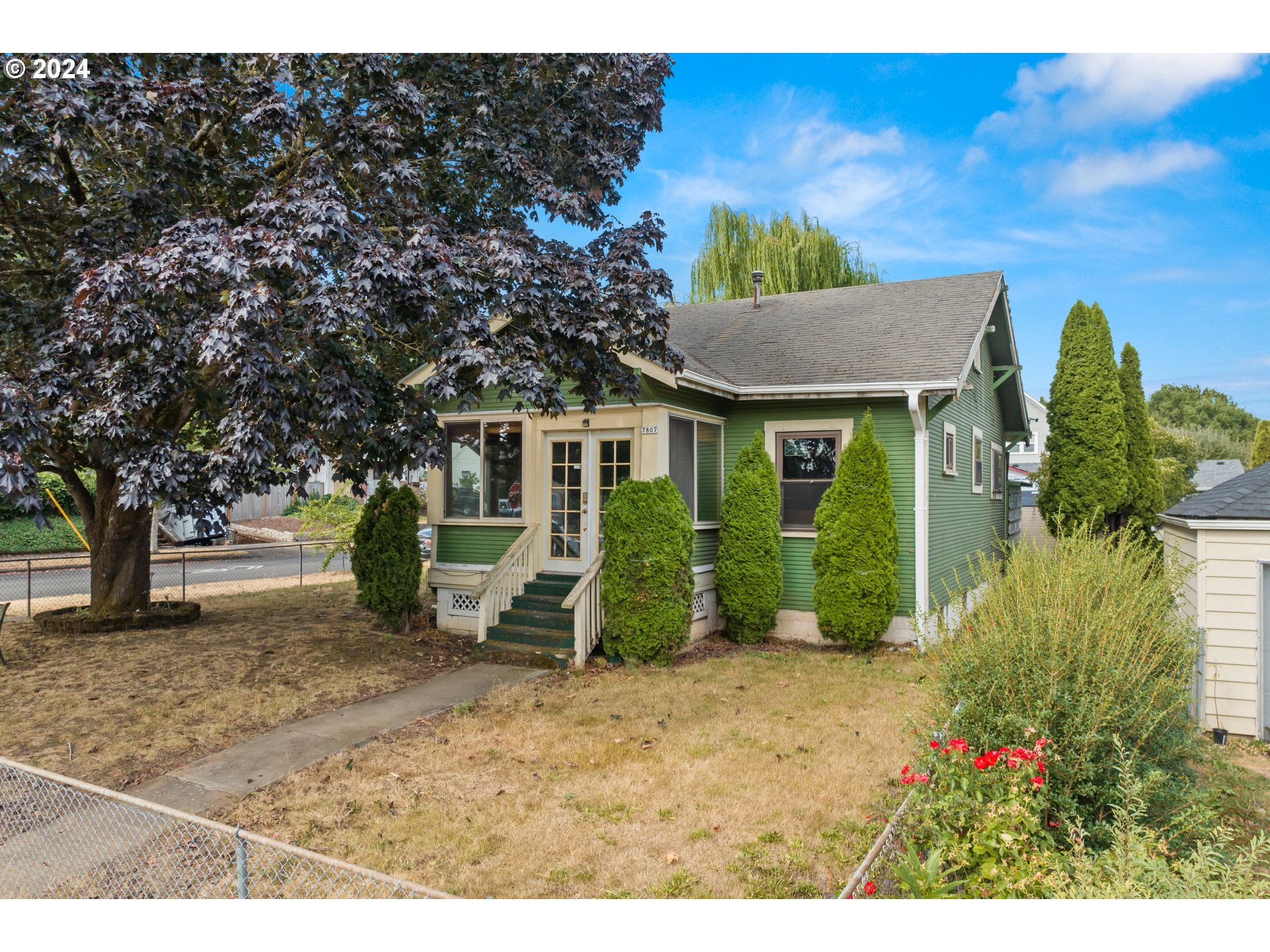 a view of a house with a garden