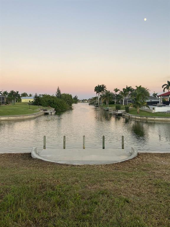 a view of a lake with houses in the background