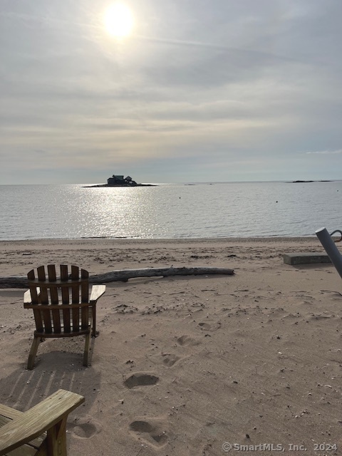 a view of a lake with wooden floor