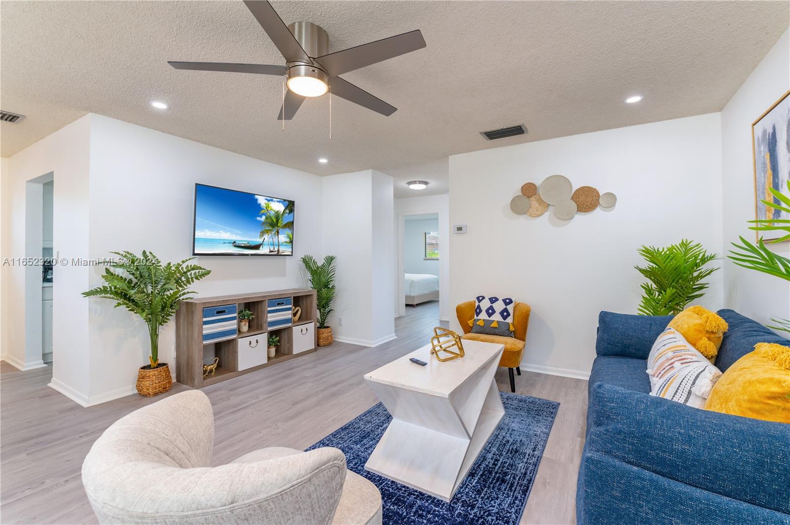 a living room with furniture fireplace and dining table