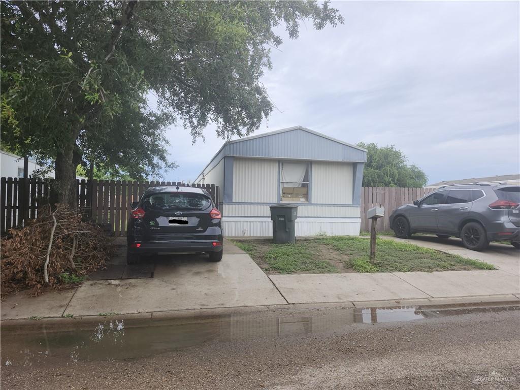 a view of a house with a yard and garage