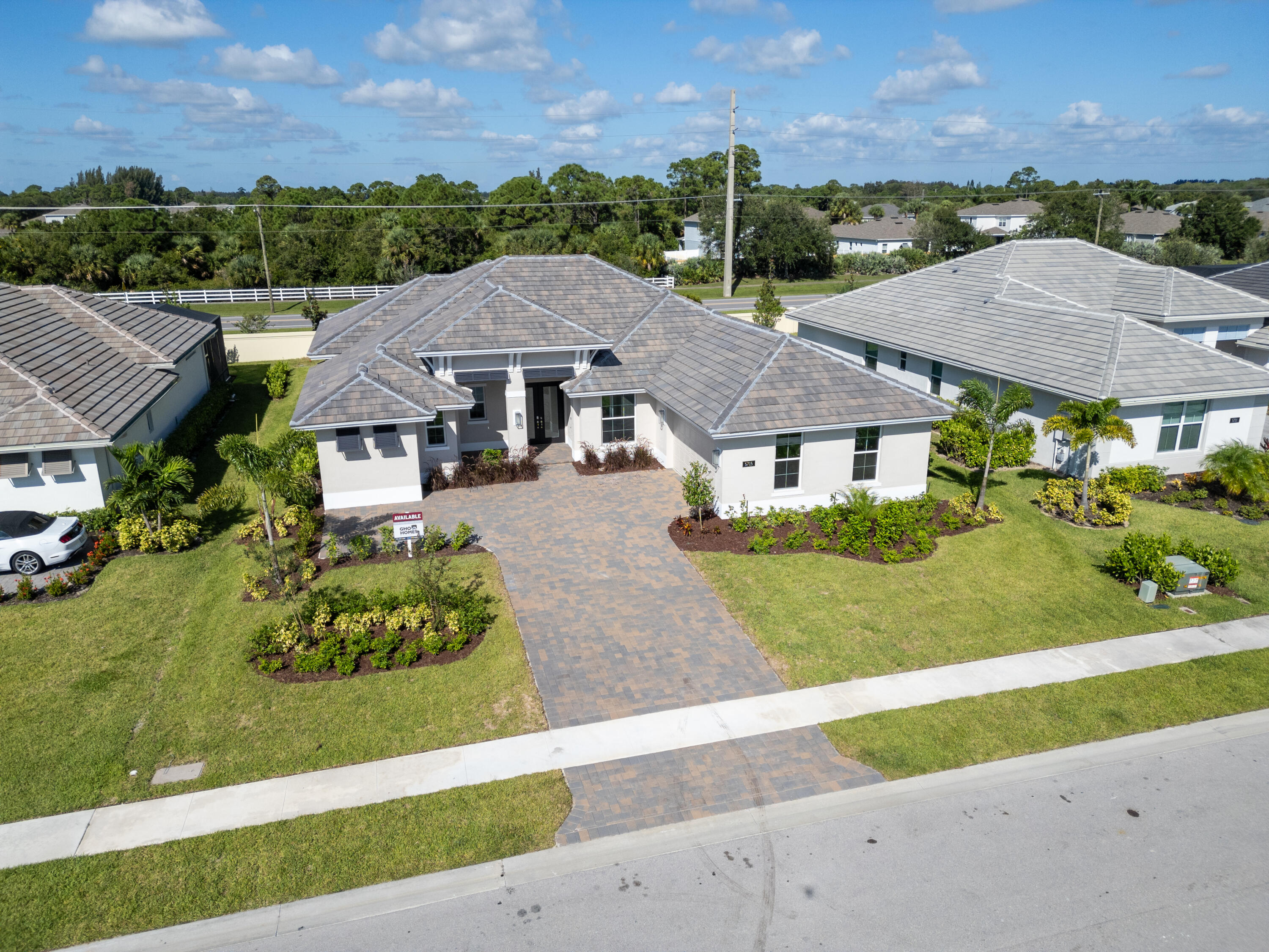 a aerial view of a house with a garden and a yard