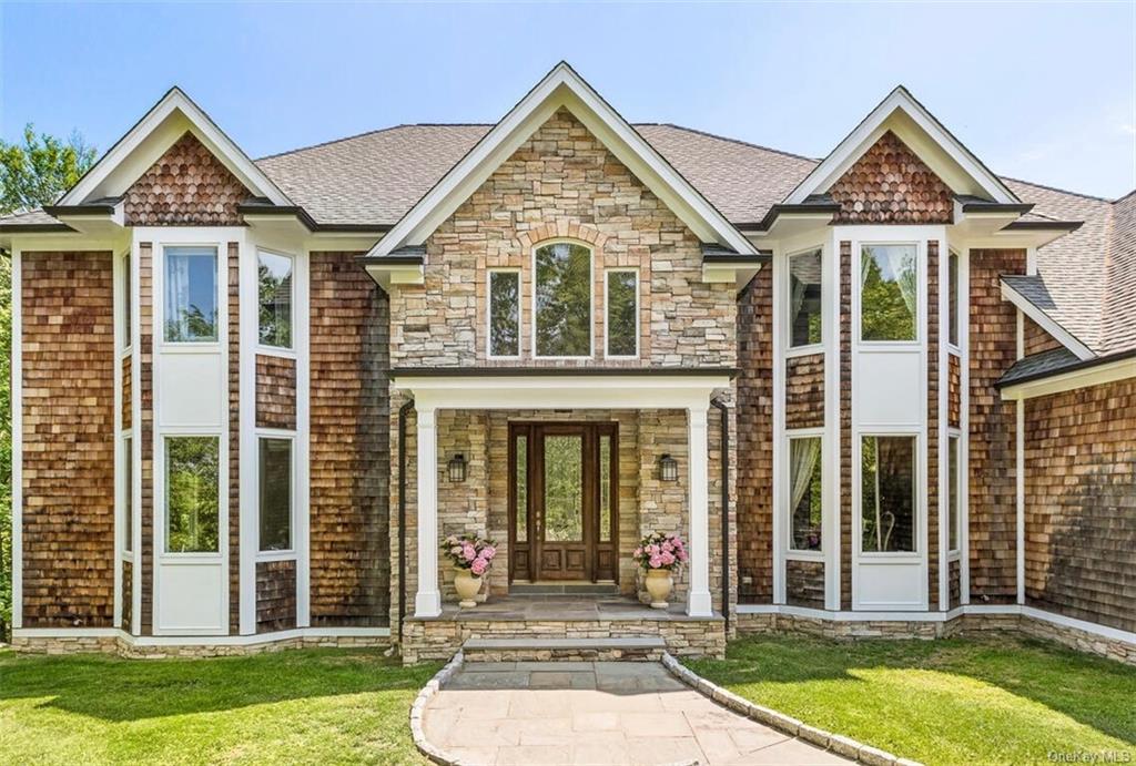 front view of a house with a yard