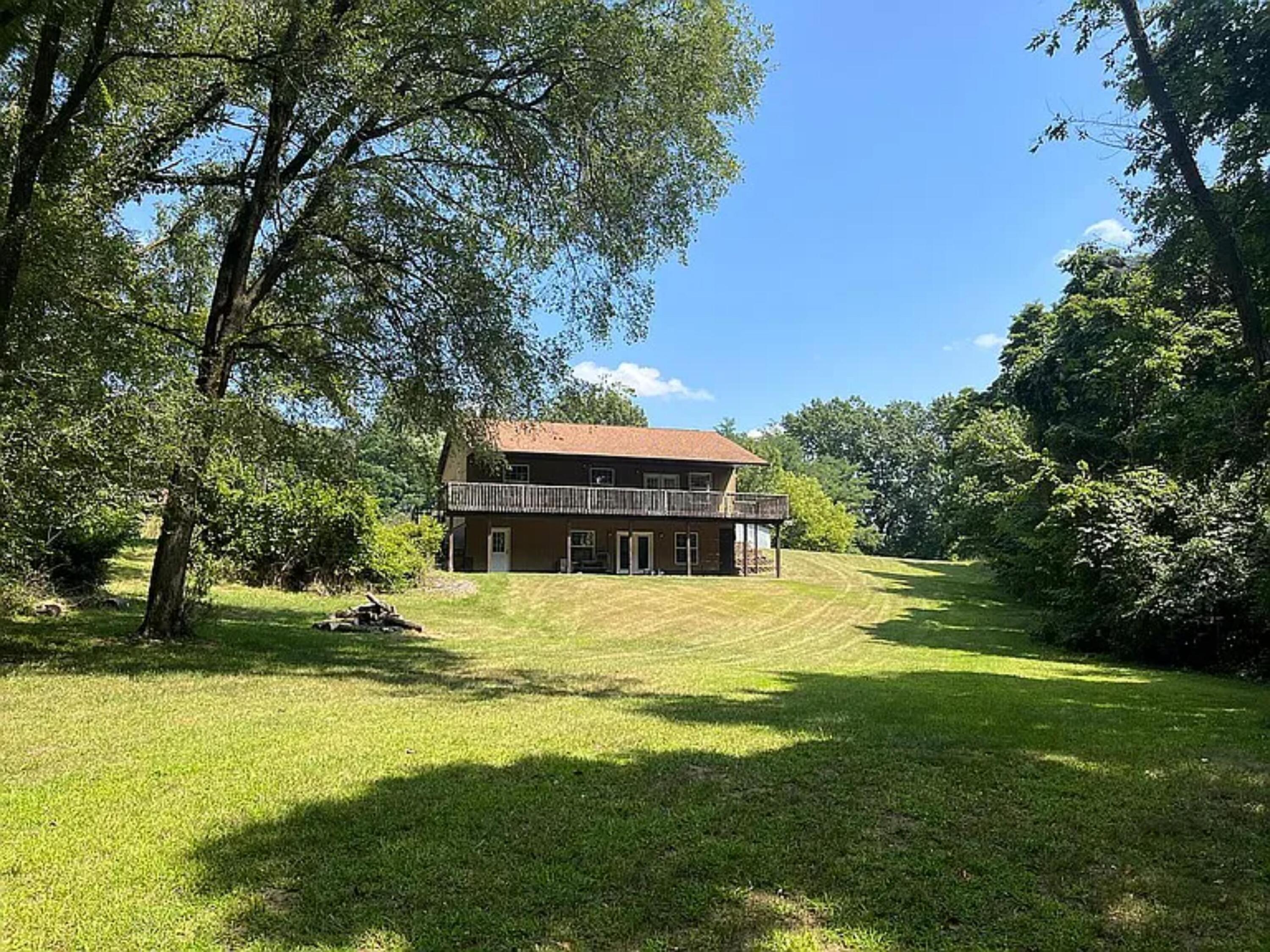 a front view of a house with a yard