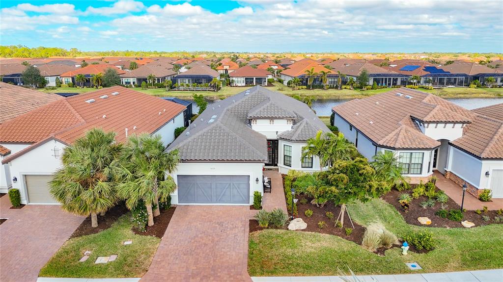 a aerial view of multiple houses with a yard