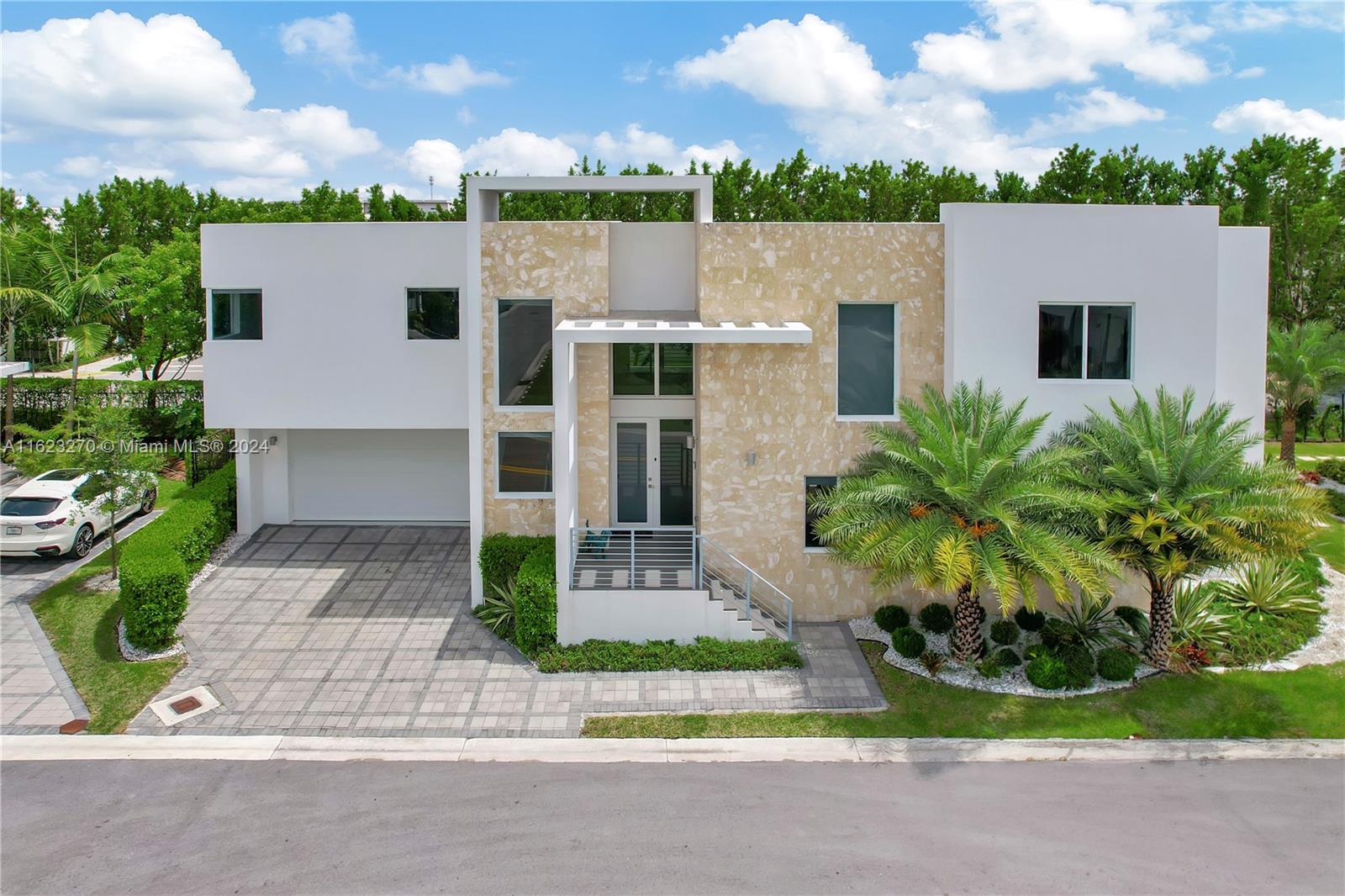 a front view of a house with garden