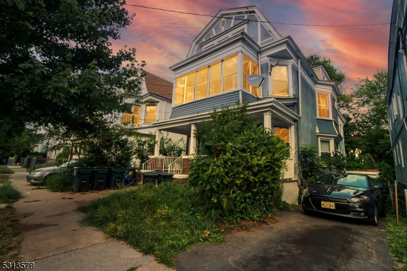 a view of a car park in front of a house