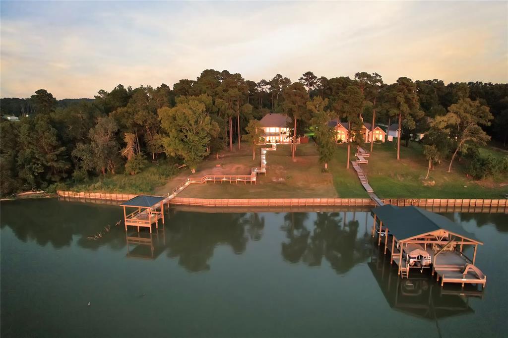 a view of a lake in between two chairs