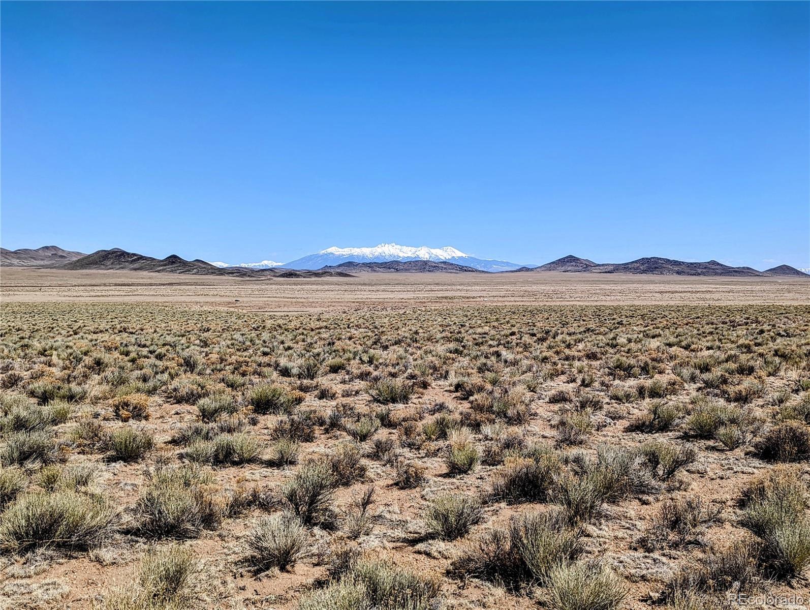 a view of a large body of water and mountain