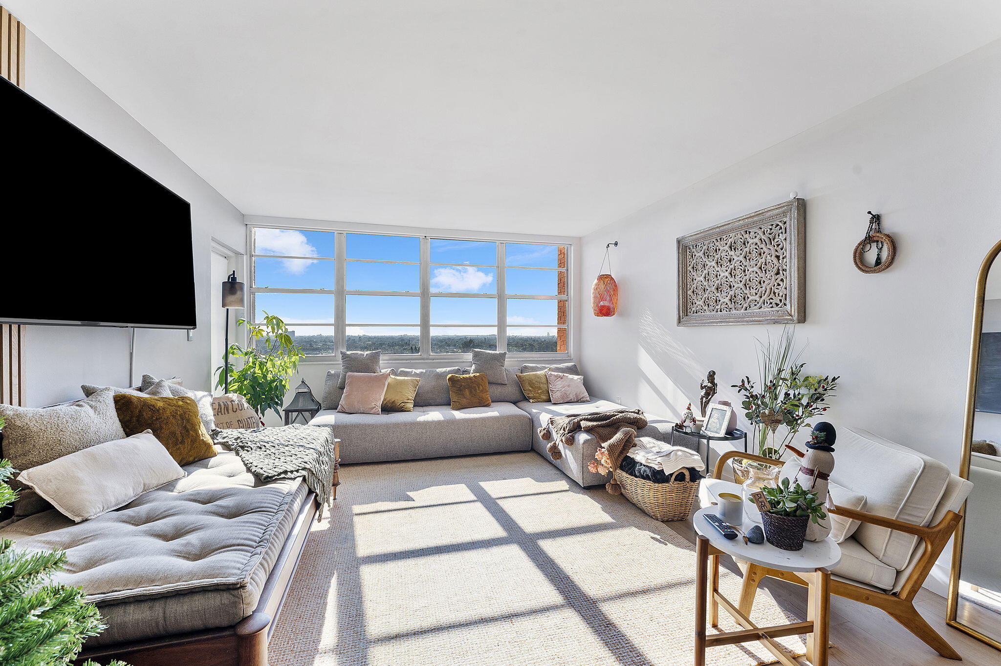 a living room with furniture and a flat screen tv