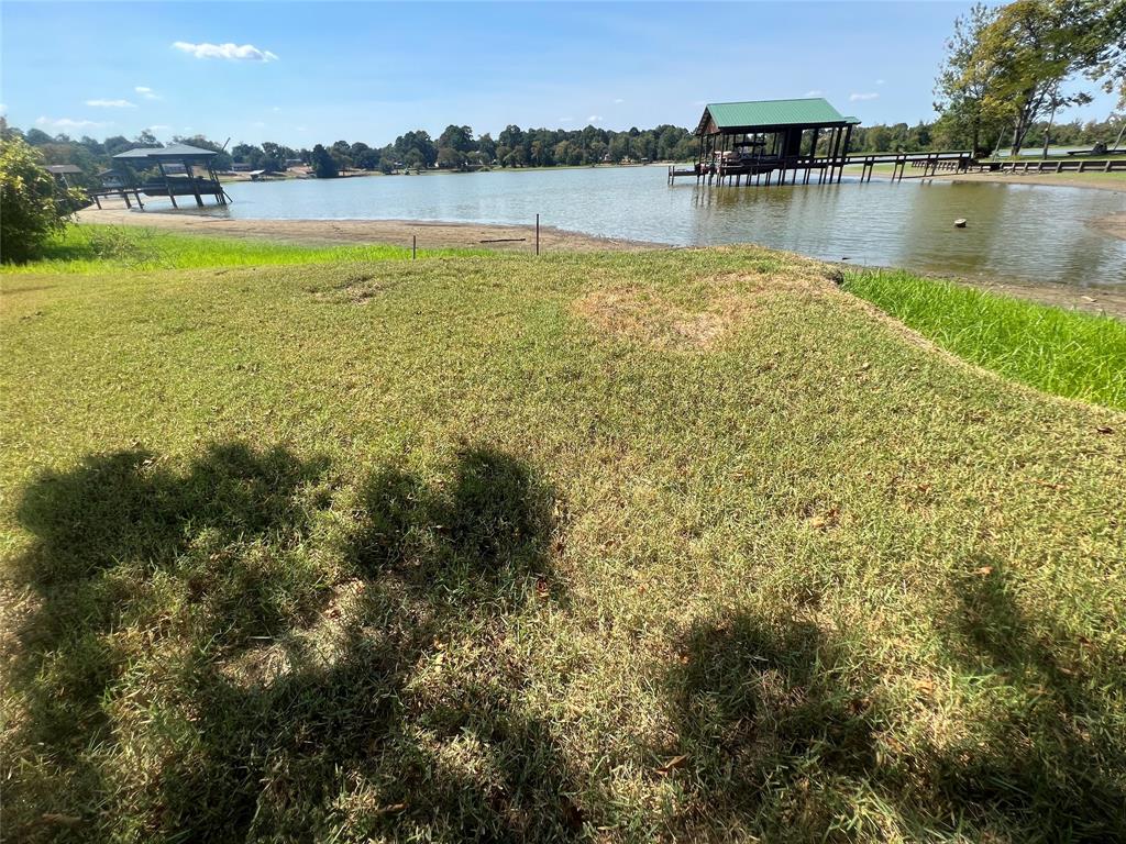 a view of a lake with houses in the back