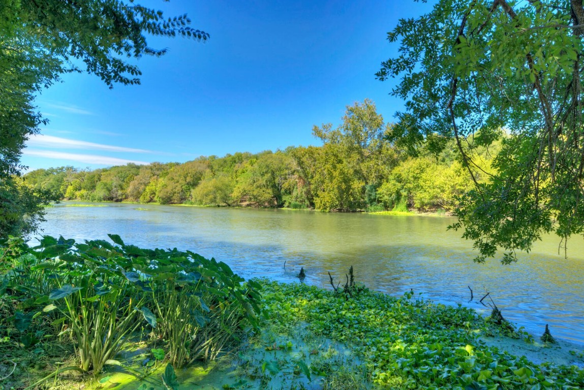 a view of lake with green space