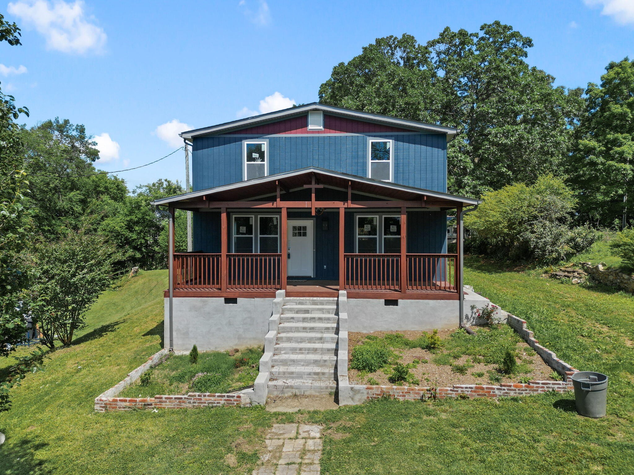 front view of a house with a yard