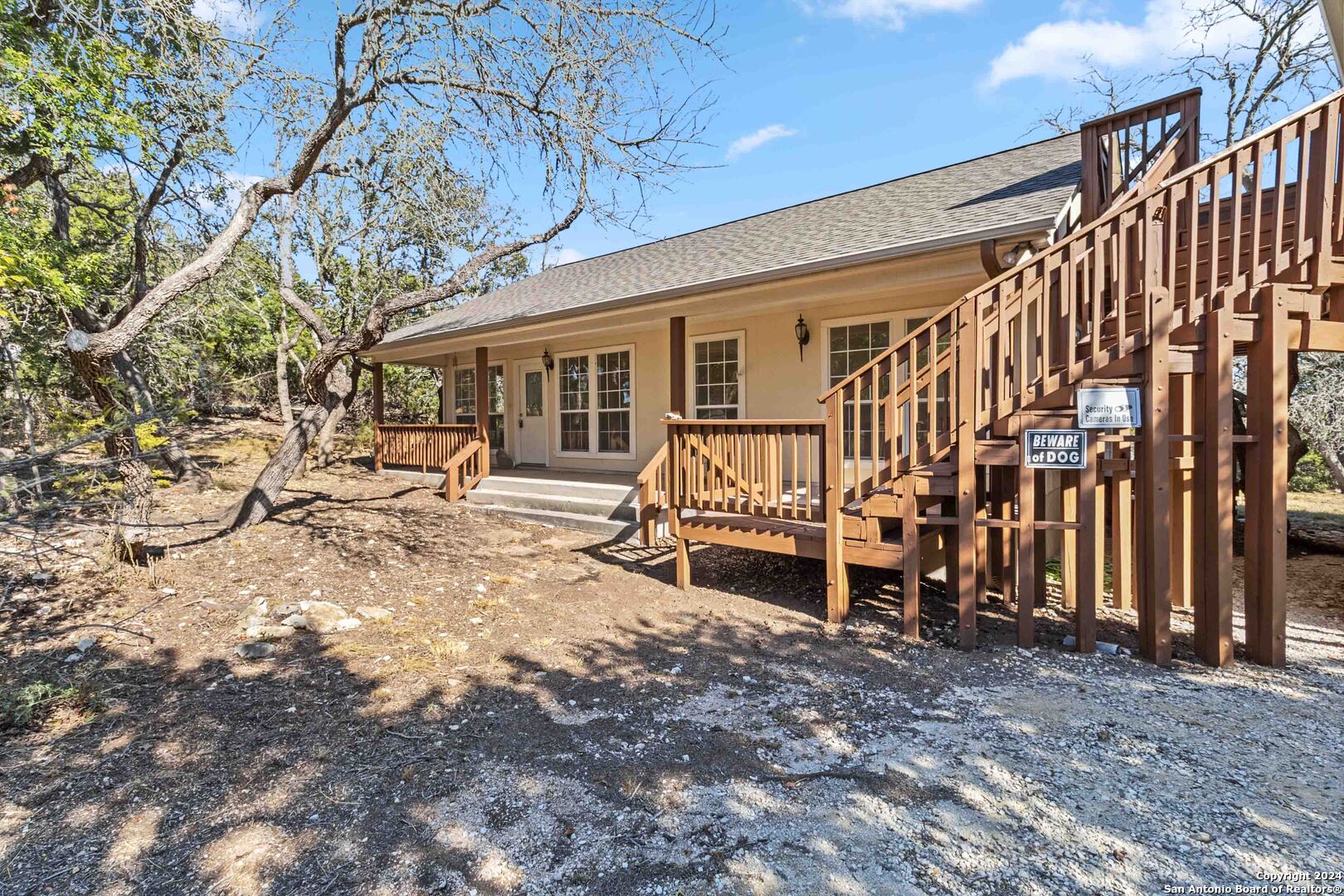 a view of a house with backyard porch and sitting area