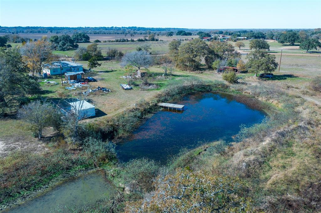 an aerial view of a houses with outdoor space