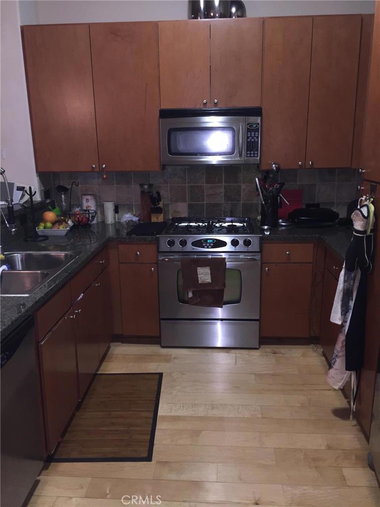 a kitchen with a stove and a microwave