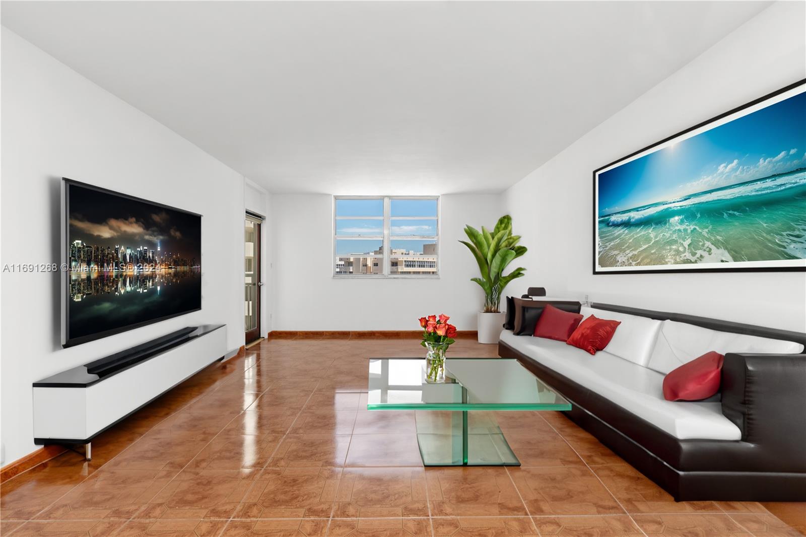 a living room with furniture and a flat screen tv