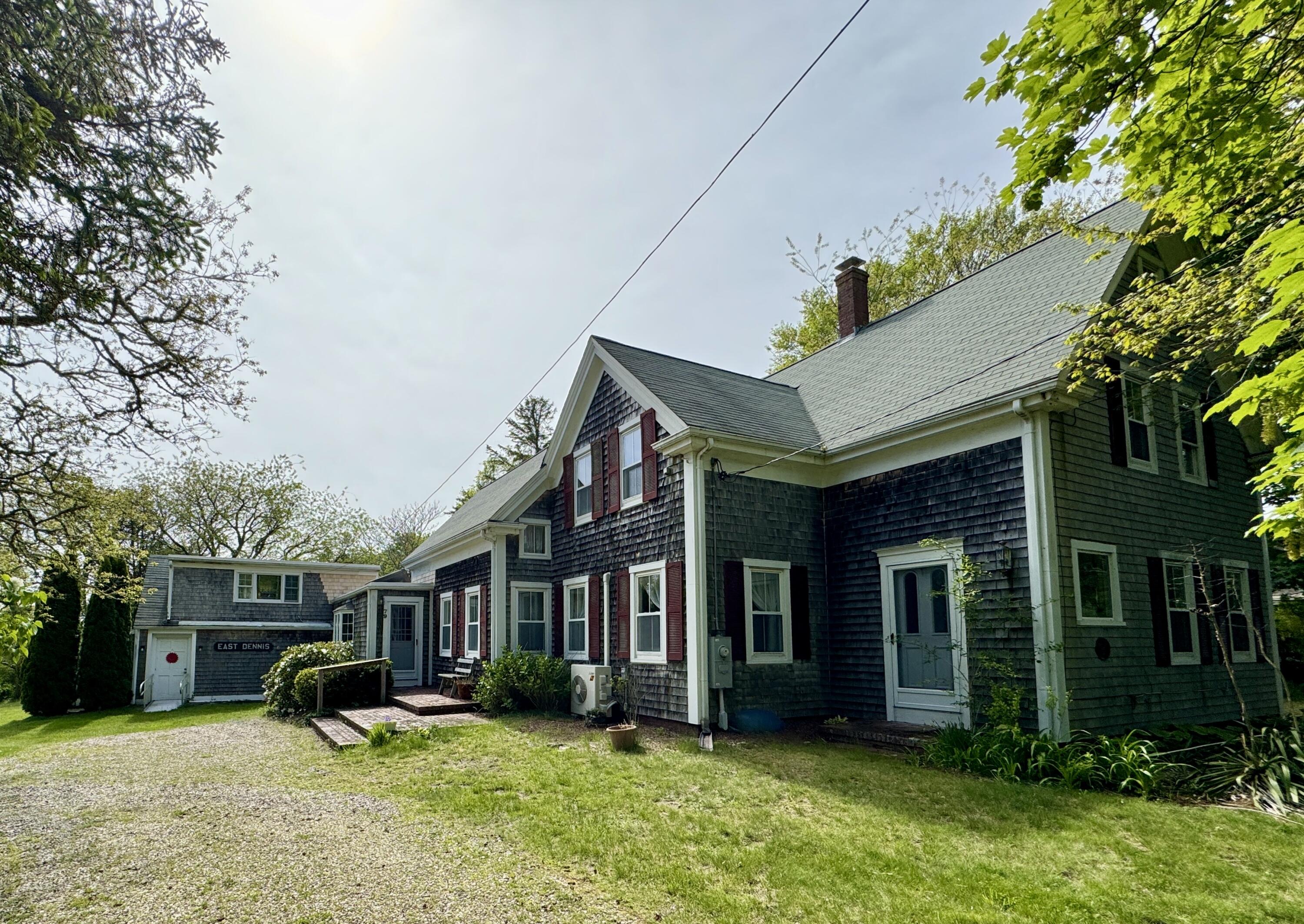 a view of a house with a yard porch and sitting area