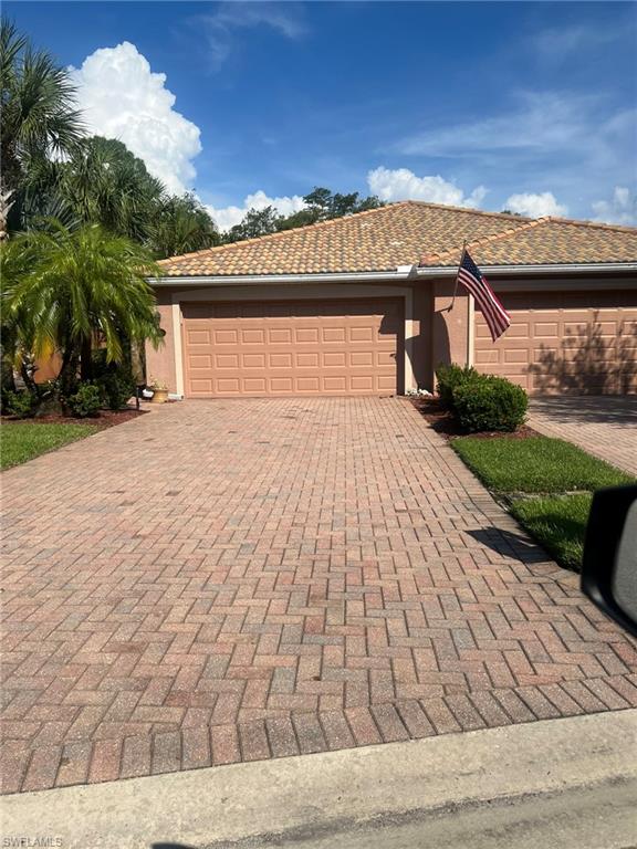 Single story home featuring a garage